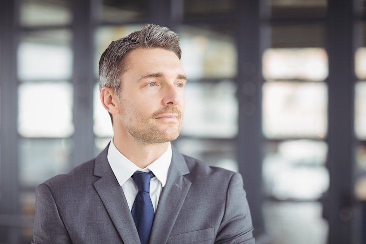 Handsome businessman looking away